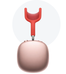 Rose gold portable speaker with a red handle and mesh grille.