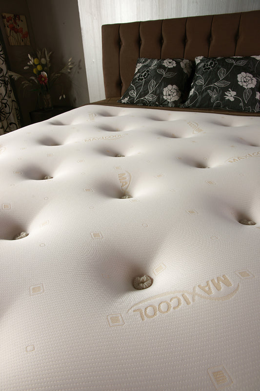 Tender Sleep medium firm orthopaedic mattress with a breathable faux leather base and body-contouring design